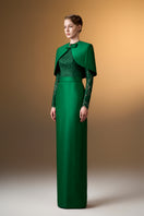 Green I.H.F gown with round neck, long sleeves, and a mini cape, featuring a sleek and elegant column silhouette.