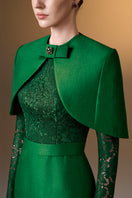 Green I.H.F gown with round neck, long sleeves, and a mini cape, featuring a sleek, elegant design.