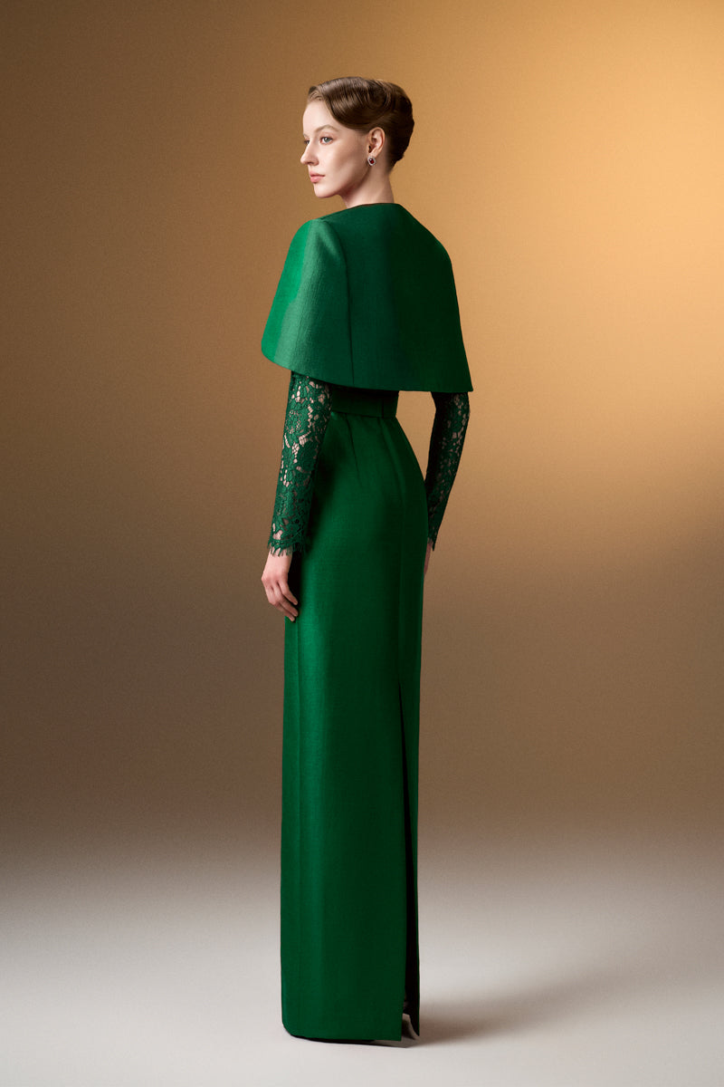 Green I.H.F gown with round neckline, long sleeves, and a mini cape, featuring a stylish and elegant design.