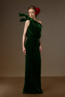 Dark green velvet I.H.F Isadora one-shoulder gown with asymmetric design and flowing drape, elegant evening dress