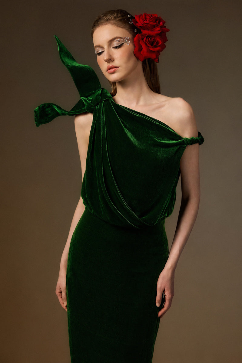 Dark green velvet one-shoulder gown with asymmetric design and flowing drape, by I.H.F, perfect for formal occasions.