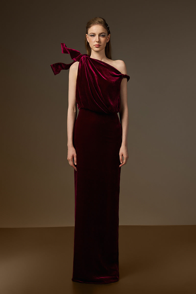 Dark pink velvet one-shoulder gown with asymmetric design and flowing drape, by I.H.F. Perfect for elegant evening occasions.