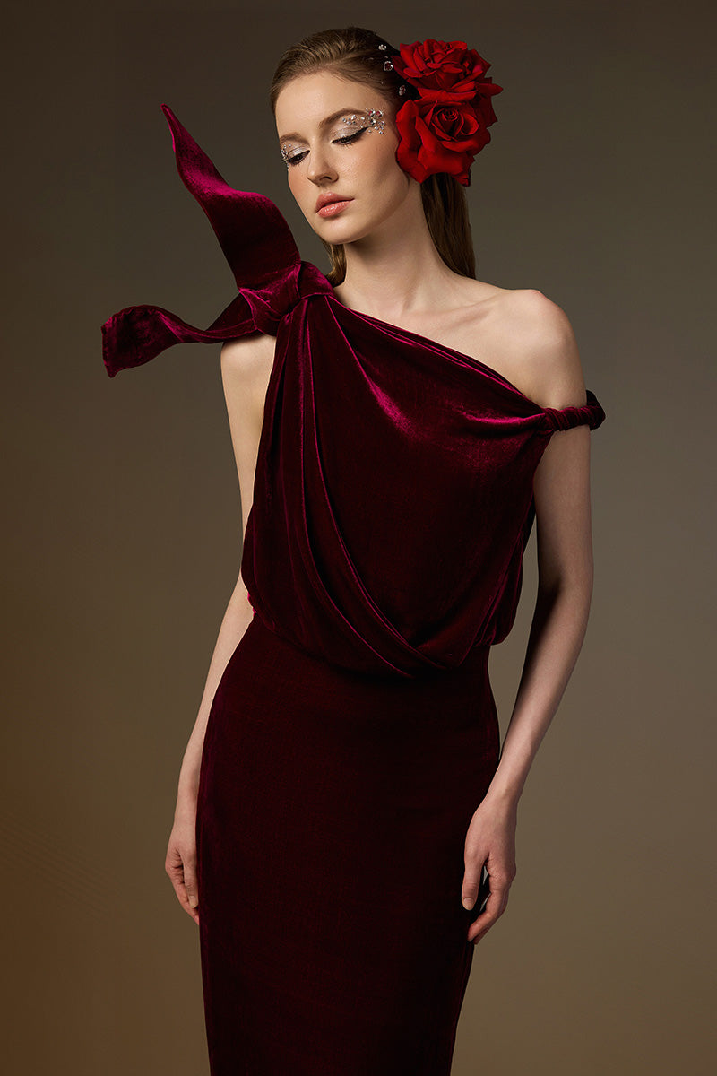 Dark pink one-shoulder velvet gown by I.H.F featuring an asymmetric design and flowing drape detail.