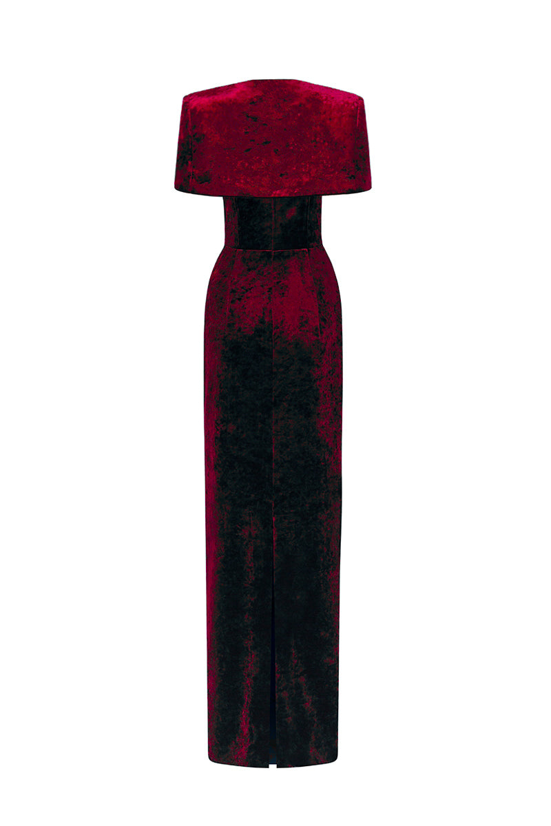 Dark red strapless column gown with a mini cape in grain velvet by I.H.F, featuring a sleek, elegant silhouette and textured fabric.
