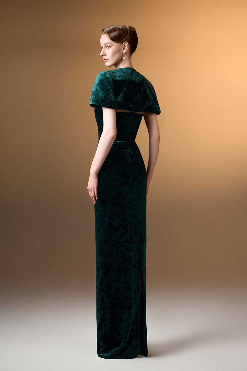 Green strapless column gown with mini cape in grain velvet from I.H.F, shown on a model against a neutral background.