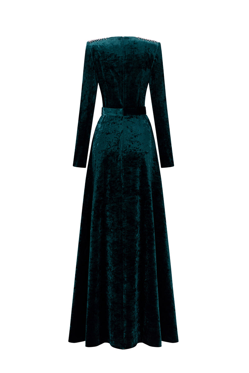 Green V-neck A-line gown with long sleeves in grain velvet by I.H.F, shown on a model with a flowing design.