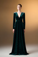 Green V-neck A-line gown with long sleeves in grain velvet by I.H.F, shown on a model with a flowing silhouette.