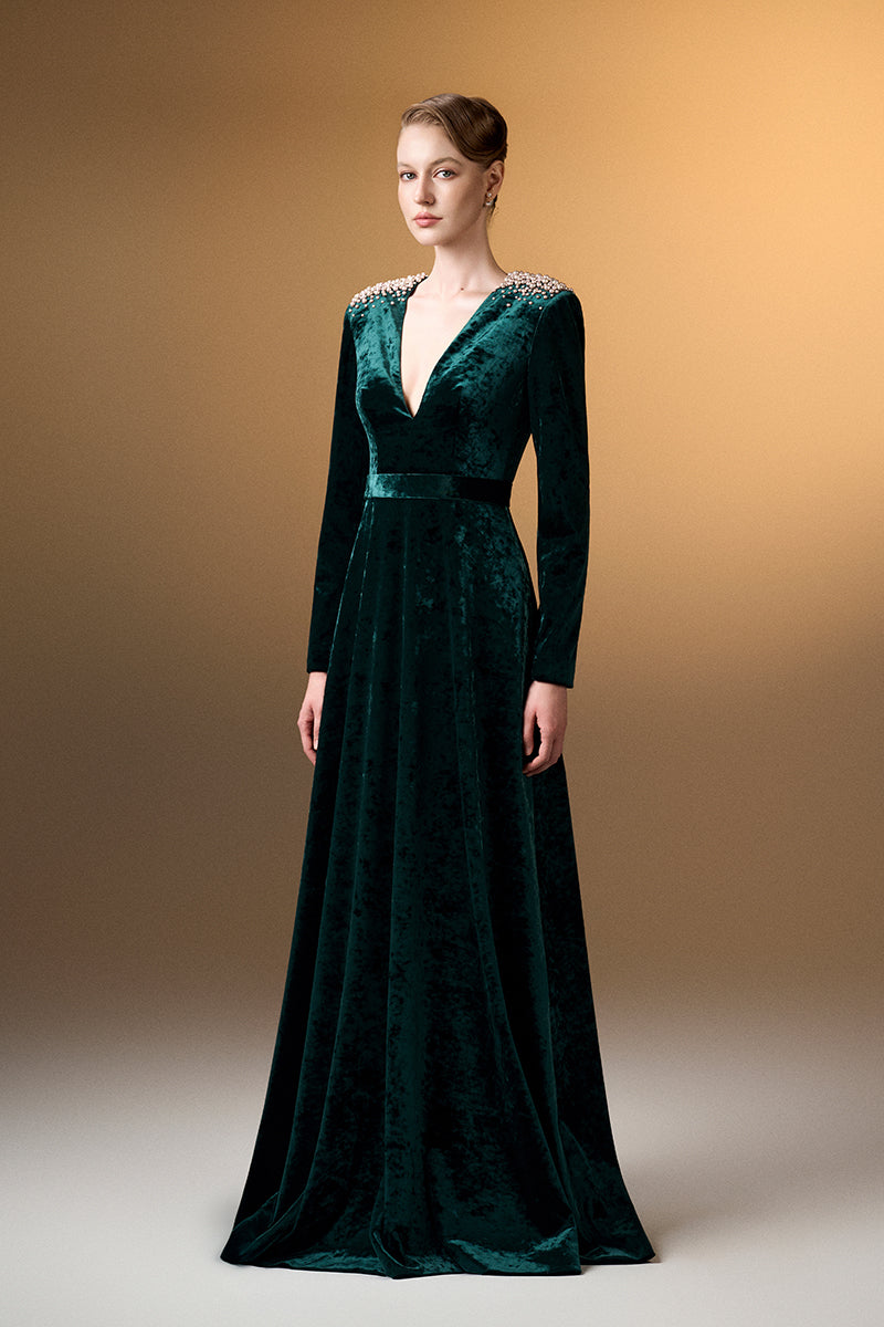 Green V-neck A-line gown with long sleeves in grain velvet by I.H.F, featuring a sleek and elegant design.