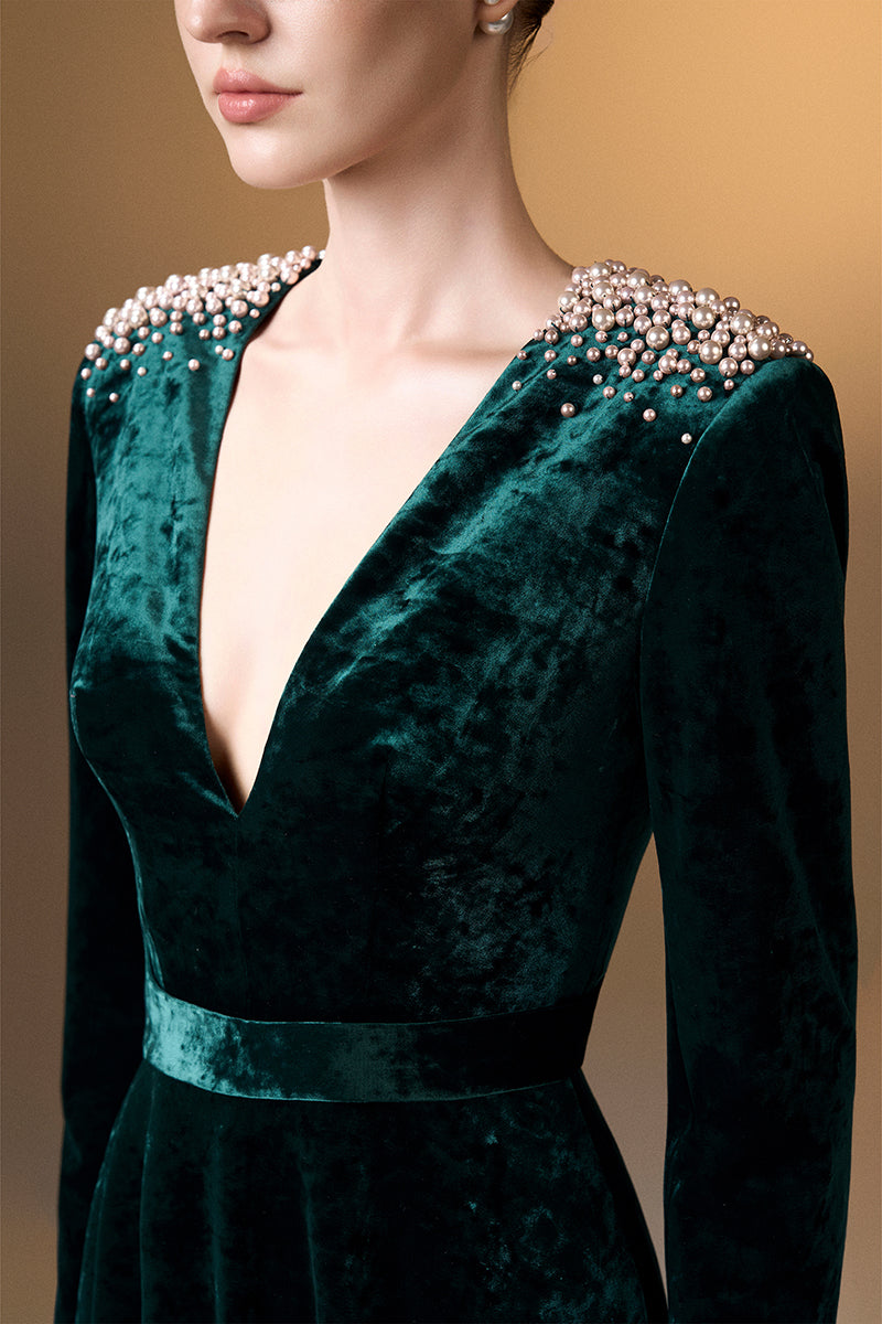 Green V-neck A-line gown with long sleeves in grain velvet by I.H.F, featuring a flowing silhouette and elegant design.