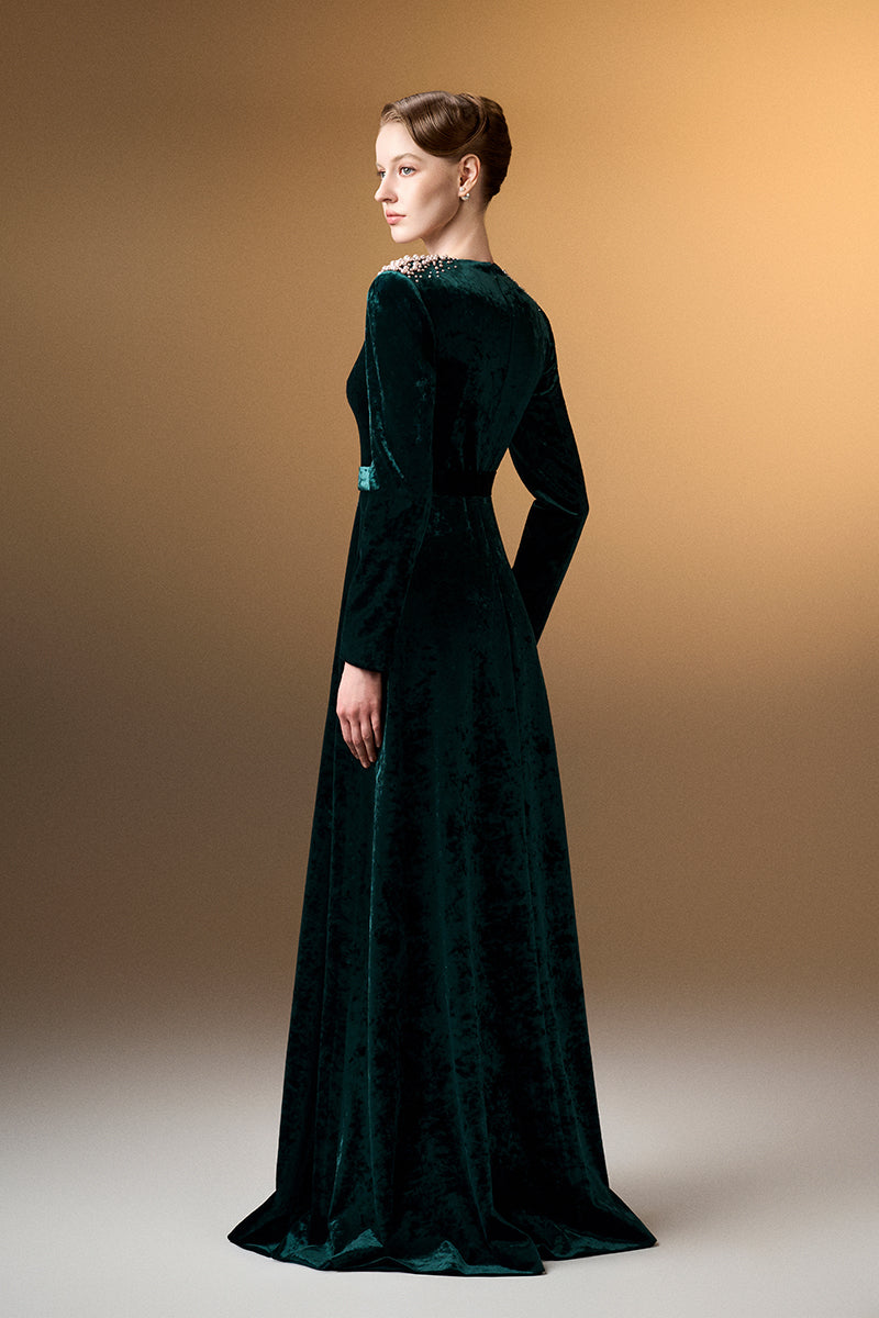 Green V-neck A-line gown with long sleeves in grain velvet by I.H.F, shown on a model against a neutral background.
