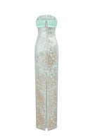 Green metallic jacquard and silk taffeta gown by I.H.F, featuring intricate fabric details and elegant design.