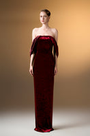 Dark red strapless column gown with pleated sleeves in grain velvet by I.H.F, shown on a model.
