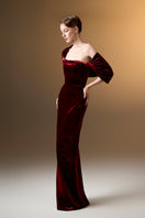 Dark red strapless column gown with pleated sleeves in grain velvet by I.H.F, showcasing elegant fabric and sleek silhouette.