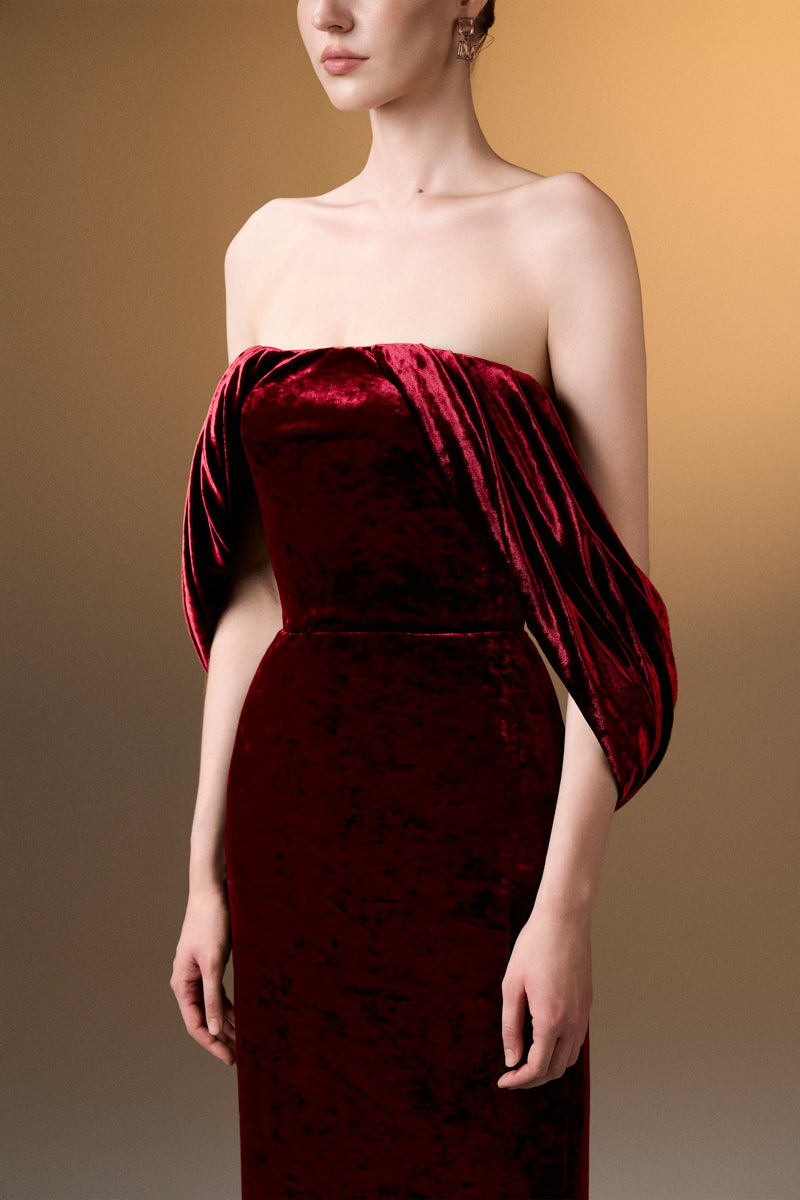 Dark red strapless column gown with pleated sleeves in grain velvet by I.H.F, elegant evening dress with a sleek silhouette.