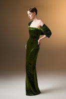 Light green strapless gown with pleated sleeves in grain velvet by I.H.F, featuring a sleek column silhouette.