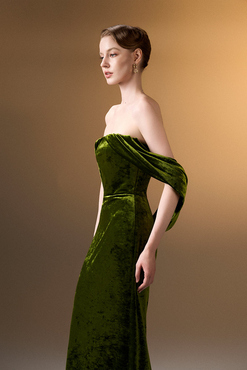 Light green strapless column gown with pleated sleeves in grain velvet by I.H.F, elegant formal dress on a model.