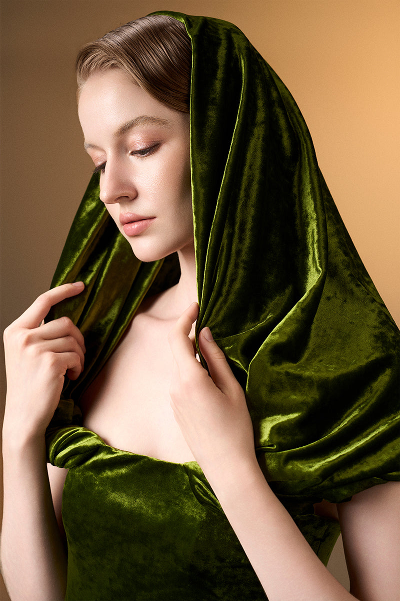 Light green strapless column gown with pleated sleeves in grain velvet by I.H.F, showcasing elegant drape and luxurious fabric.