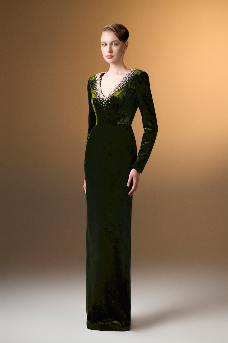 Green V-neck column gown with long sleeves in grain velvet by I.H.F, showcasing elegant drape and textured fabric.