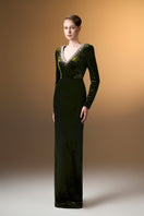 Green V-neck column gown with long sleeves in grain velvet by I.H.F, showcasing elegant drape and textured fabric.
