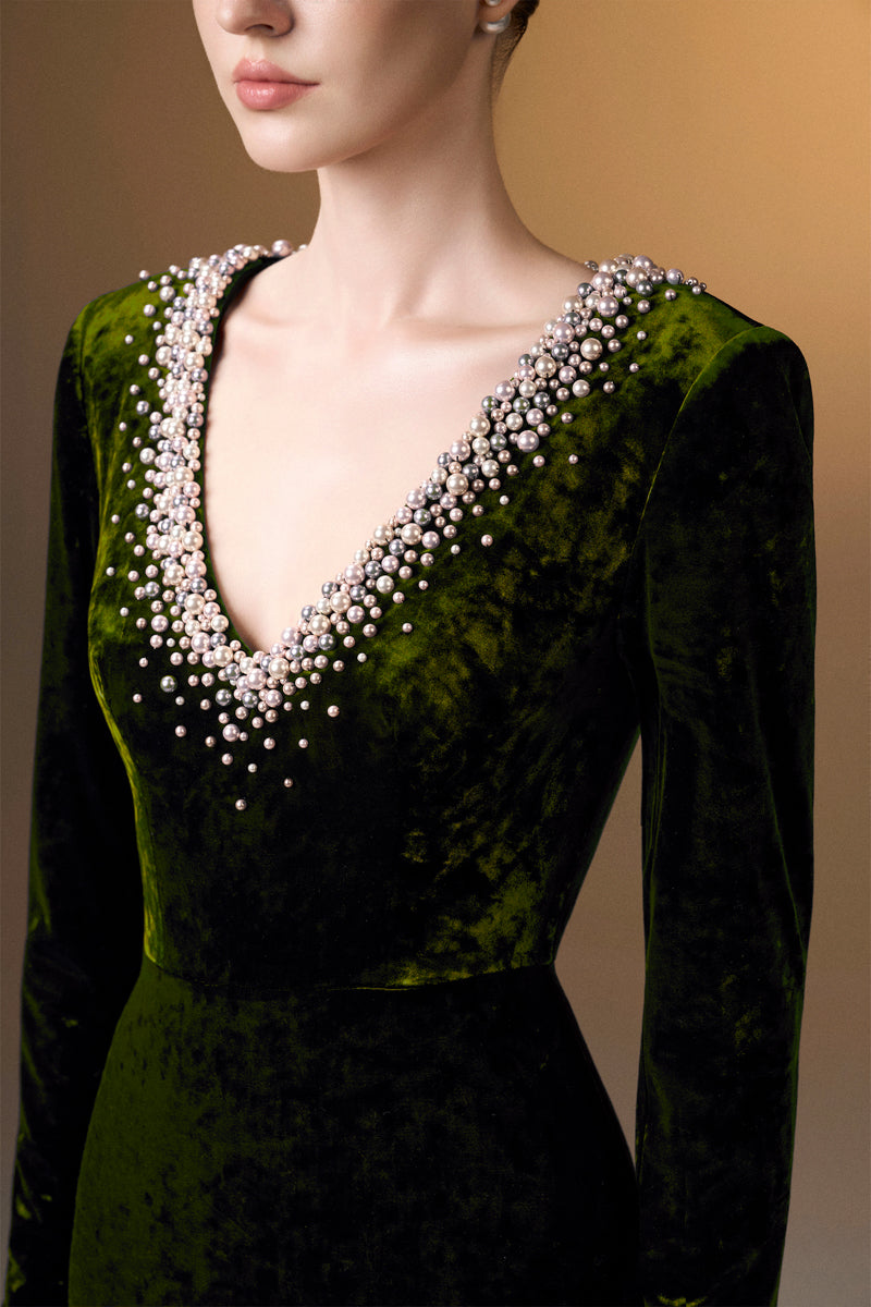 Green V-neck column gown with long sleeves in grain velvet by I.H.F, featuring a sleek, elegant silhouette.