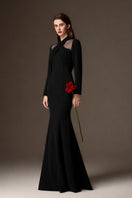 Black crepe mermaid gown with draped details and round neckline from I.H.F, showcasing elegant fit and flowing design.