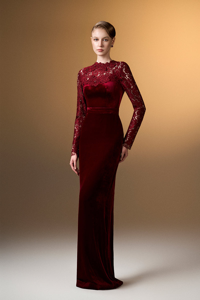 Dark red velvet gown with long sleeves and French lace details by I.H.F, showcasing elegant, flowing design.