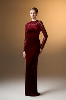Dark red velvet gown with long sleeves and French lace details by I.H.F, showcasing elegant, flowing design.