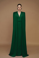 Emerald green crepe and silk taffeta gown by I.H.F, featuring elegant design and flowing fabric for formal occasions.