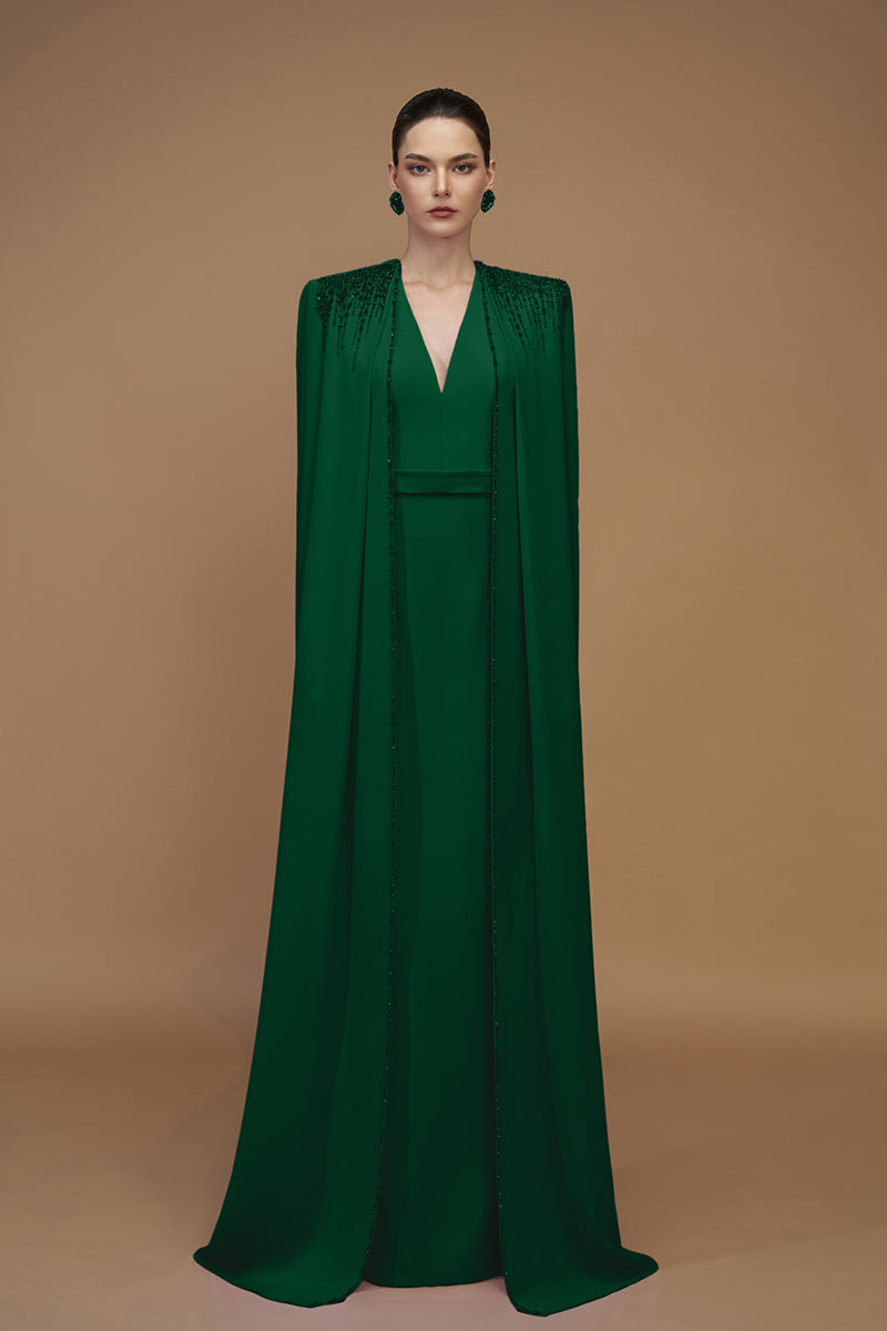 Emerald green crepe and silk taffeta gown by I.H.F, featuring elegant design and flowing fabric for formal occasions.