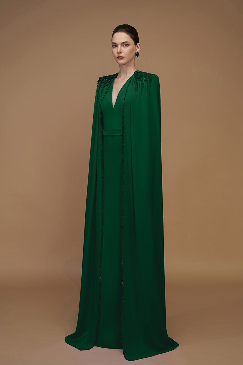 Emerald green crepe and silk taffeta cape gown by I.H.F, featuring elegant flowing fabric and sophisticated design.