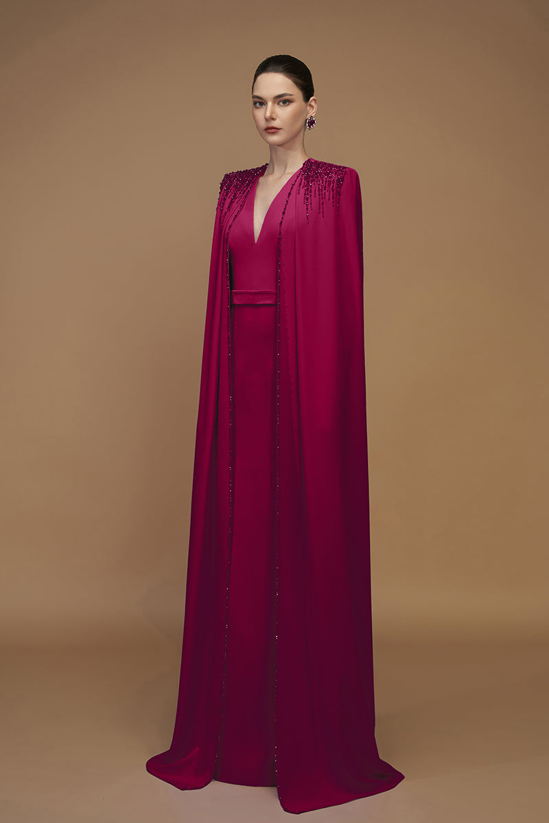 Elegant I.H.F crepe and silk taffeta cape lipstick gown featuring flowing fabric and intricate details for formal occasions.