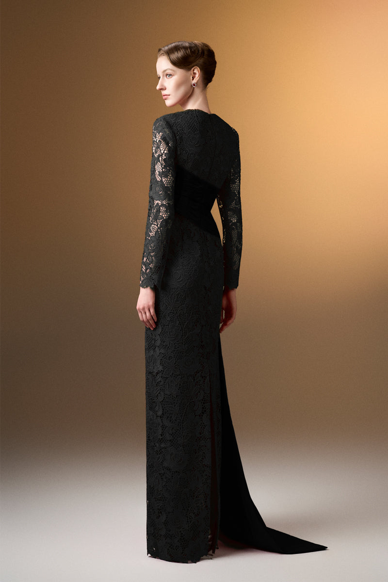 Black trapeze neck column gown in guipure lace and taffeta by I.H.F, shown on a model with elegant draping and intricate lace details.