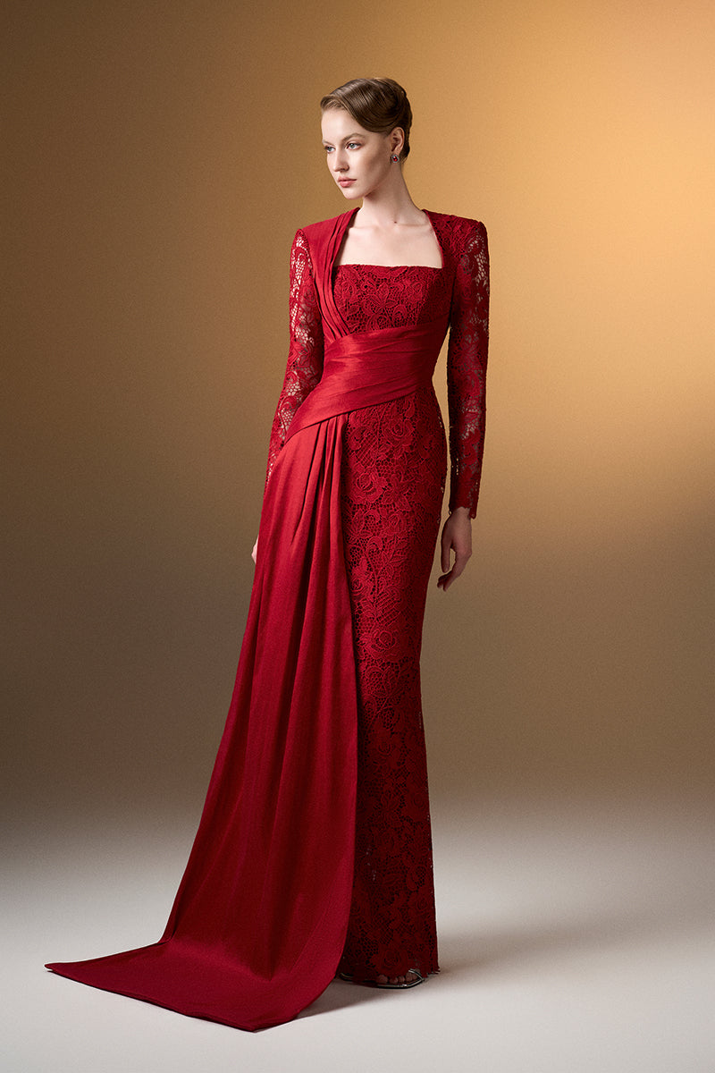 Red trapeze neck column gown by I.H.F in dark guipure lace and taffeta, shown on a model with elegant draping details.