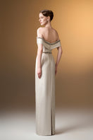 Ivory off-shoulder column gown with rose design brocade by I.H.F, elegant evening dress with intricate floral pattern.