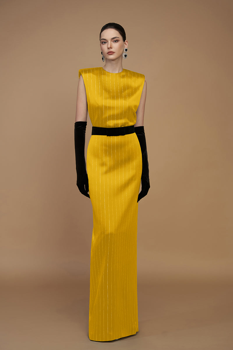 Elegant yellow striped silk gown by I.H.F with flowing fabric and stylish design, perfect for formal occasions.