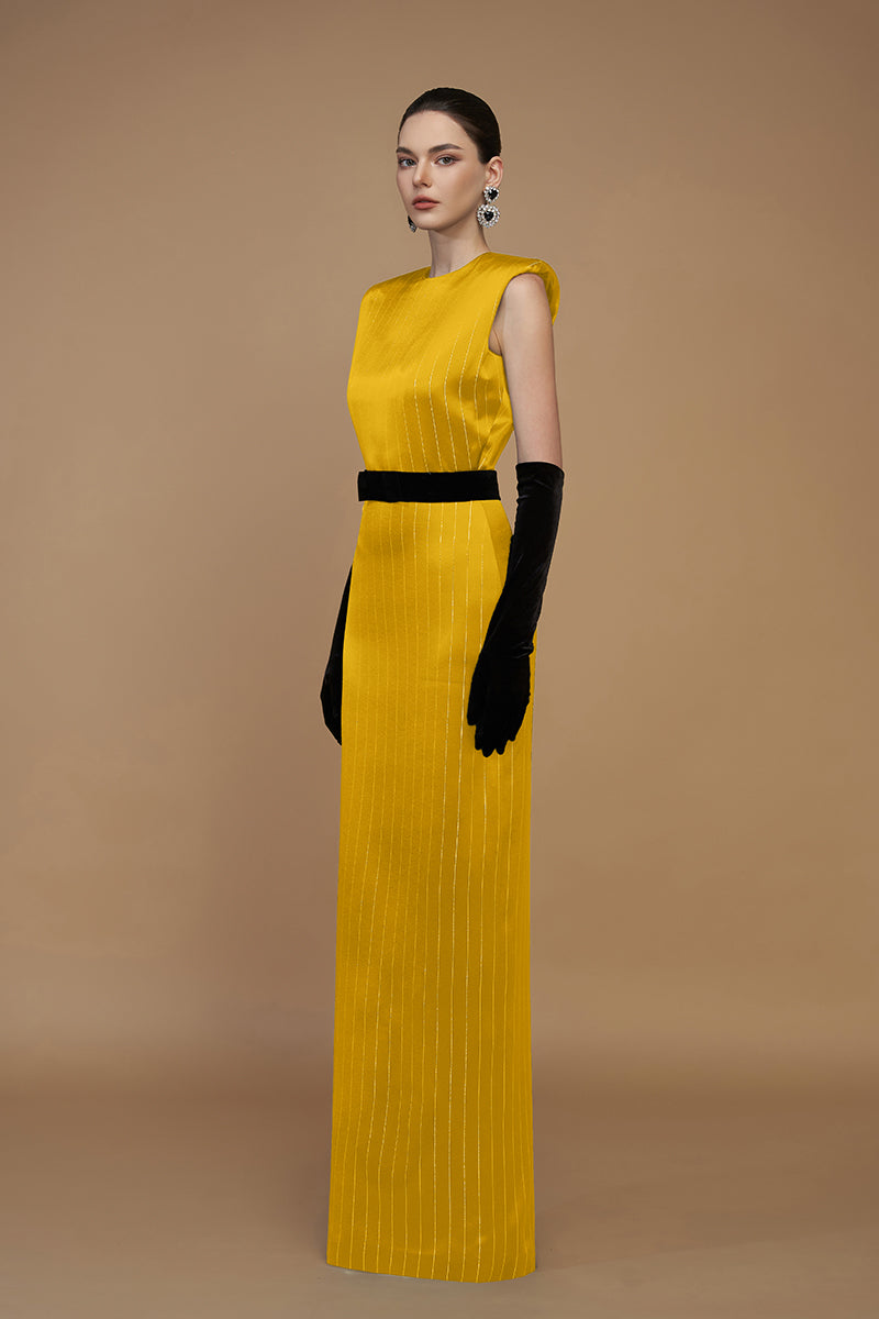 I.H.F striped yellow silk gown with elegant flowing fabric and intricate design, displayed on a hanger.
