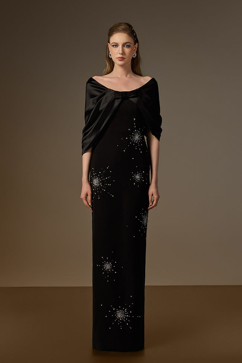 Elegant black draped V-neck column gown from I.H.F, featuring crepe fabric and satin silk details.