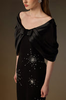 Elegant black Elodie V-neck gown by I.H.F featuring draped details in crepe and satin silk fabric.