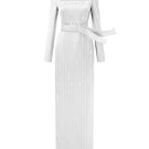 White metallic belted train column gown by I.H.F, featuring a wind-blown silk train and trapeze neckline.