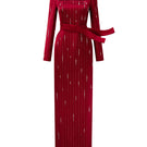 Red metallic belted train column gown by I.H.F featuring a trapeze neck and flowing silk design with a wind-blown train appearance.
