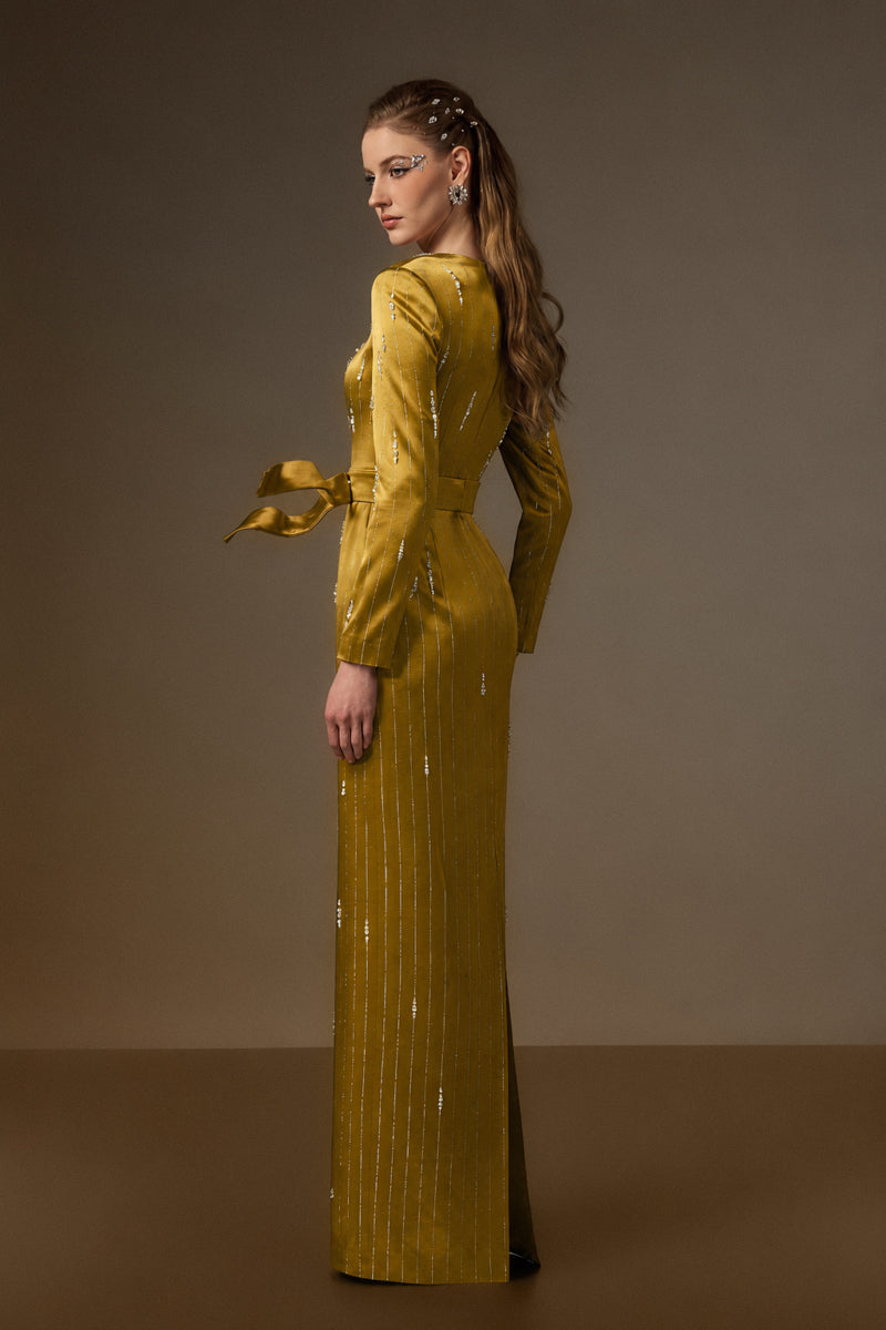 Yellow metallic belted gown by I.H.F featuring a trapeze neck and flowing train, made from stripped silk fabric.
