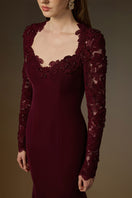 Elegant burgundy mermaid gown with trapeze neck and floral garden mesh lace, featuring a mullet hem detail by I.H.F.