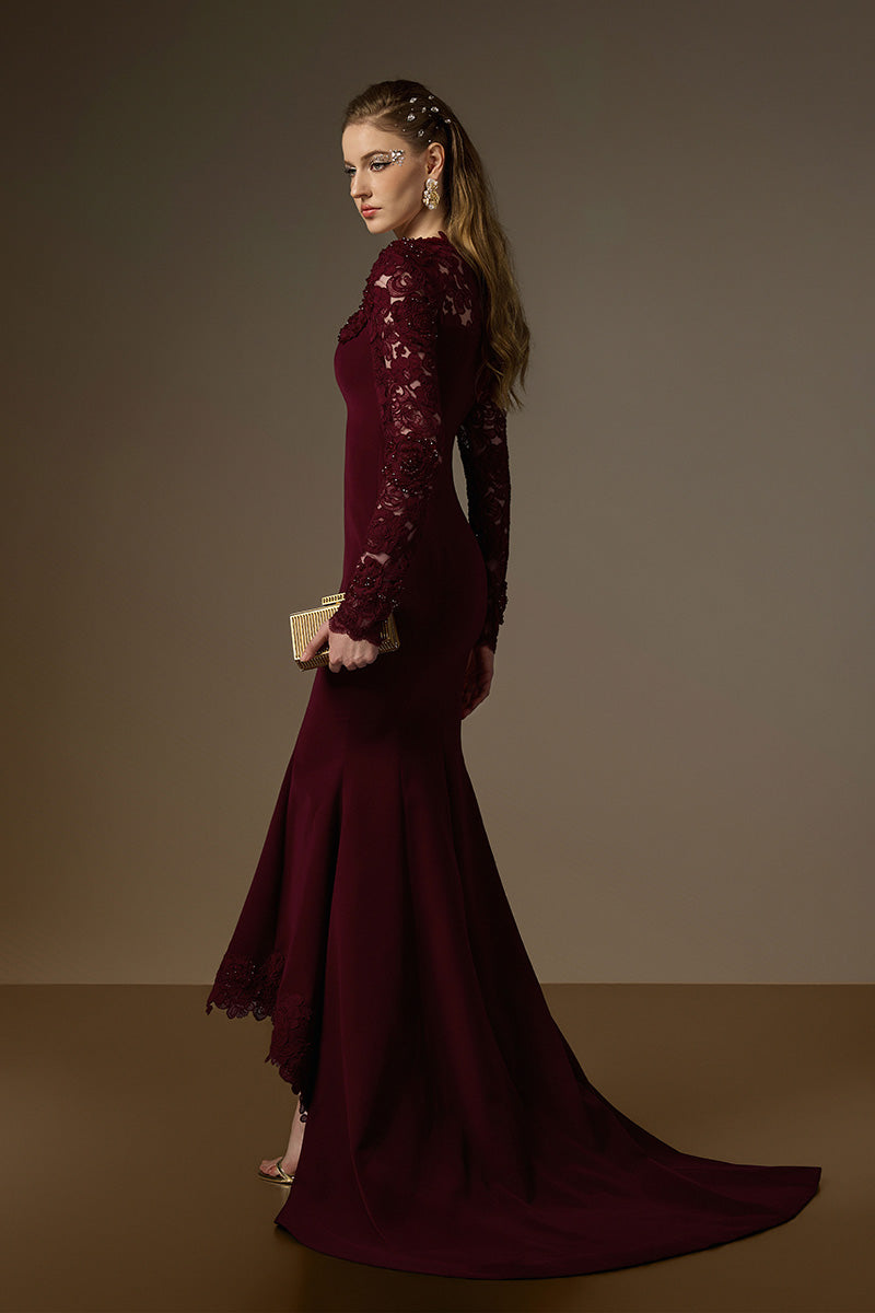 I.H.F Margaix burgundy mermaid gown with trapeze neck, floral garden mesh lace, and mullet hem, displayed on a hanger.