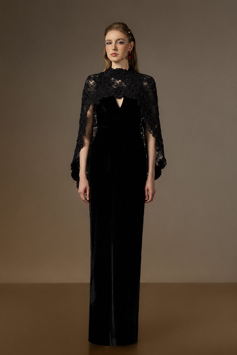 Elegant black velvet V-neck caped gown with floral garden mesh lace by I.H.F, featuring a sleek column silhouette and stylish mullet cape.