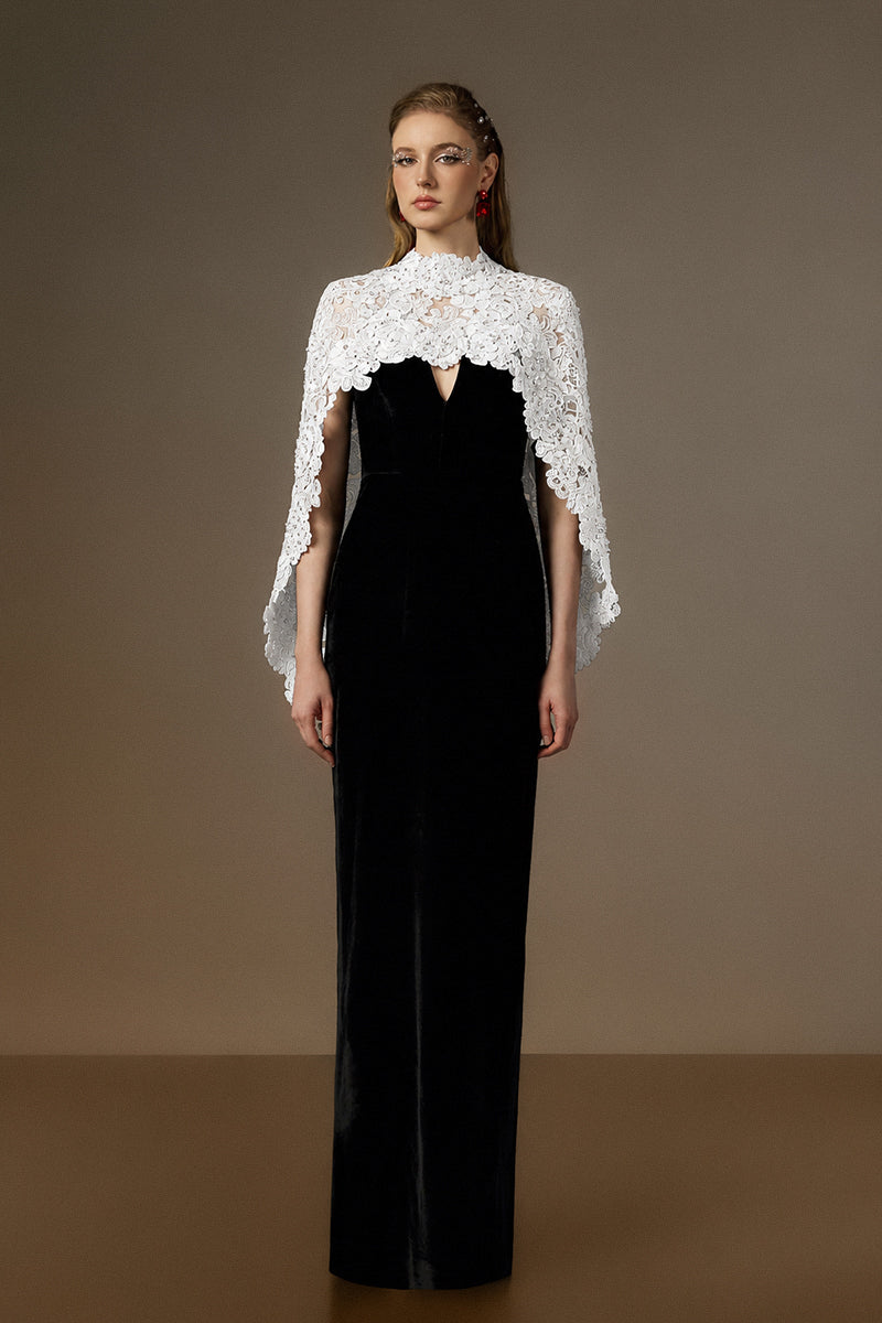 Black and white V-neck caped column gown by I.H.F featuring velvet fabric and floral garden mesh lace details.