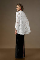 Black and white V-neck caped gown by I.H.F featuring velvet fabric and floral garden mesh lace detailing.