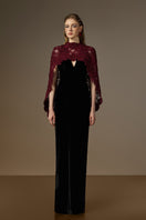 Elegant black and burgundy V-neck caped column gown by I.H.F featuring velvet fabric and red floral garden mesh lace.