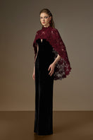 Black and burgundy V-neck caped column gown by I.H.F featuring velvet fabric and floral mesh lace detailing.