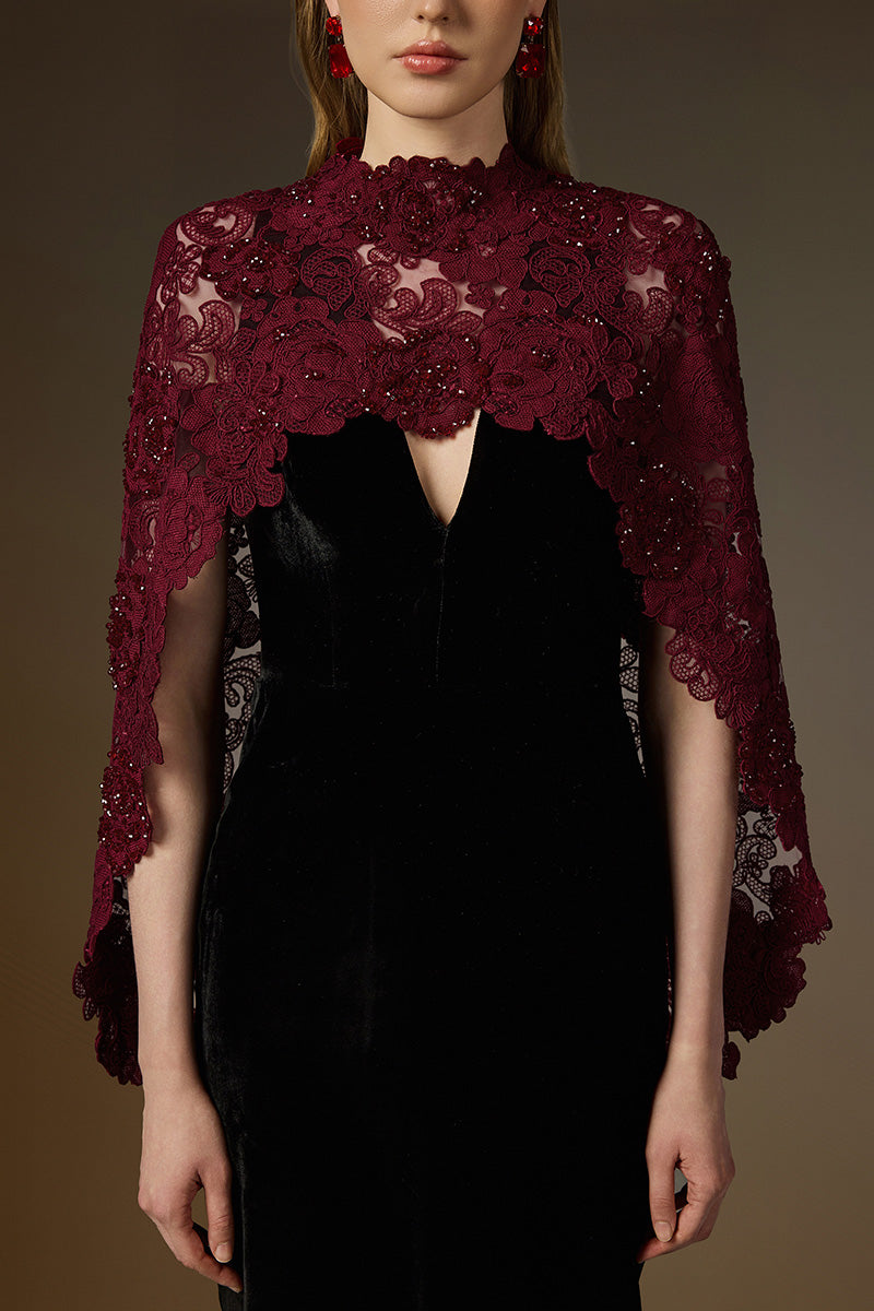 Black and burgundy V-neck caped column gown by I.H.F featuring velvet fabric and red floral garden mesh lace detail.