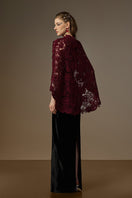 Black and burgundy V-neck caped gown by I.H.F featuring velvet fabric and red floral mesh lace details.